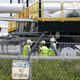 Workers at Enbridge Energy's terminal in Superior, Wisconsin, as seen in June 2018.